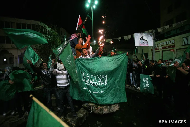Palestinians celebrate what they say is a victory over Israel after an eight-day conflict, in the West Bank city of Hebron, November 21, 2012. Israel and the Islamist Hamas movement agreed on Wednesday to an Egyptian-spo...