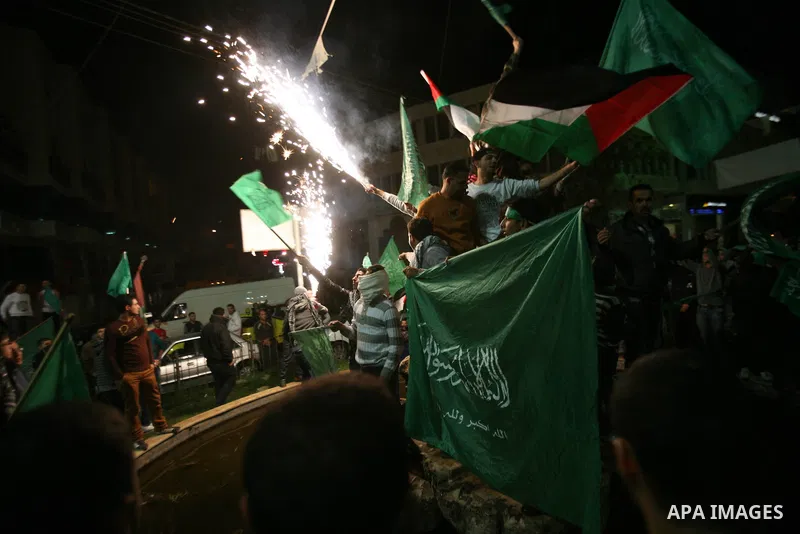 Palestinians celebrate what they say is a victory over Israel after an eight-day conflict, in the West Bank city of Hebron, November 21, 2012. Israel and the Islamist Hamas movement agreed on Wednesday to an Egyptian-spo...