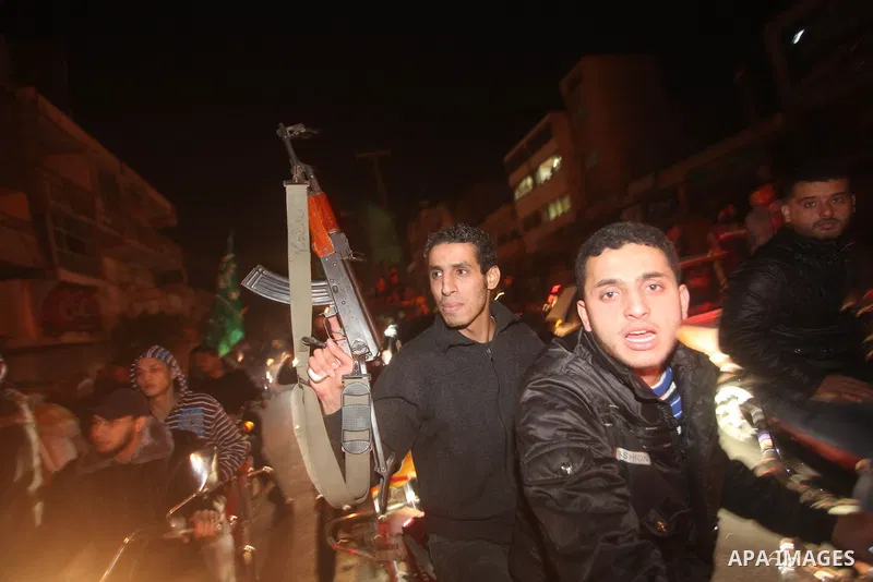 Palestinians celebrate what they say is a victory over Israel after an eight-day conflict in Gaza City, November 21, 2012. Israel and the Islamist Hamas movement agreed on Wednesday to an Egyptian-sponsored ceasefire to...