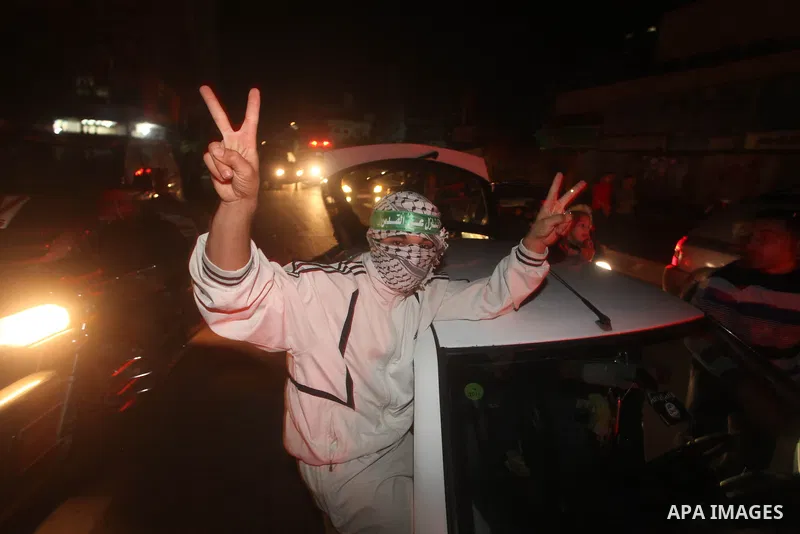 Palestinians celebrate what they say is a victory over Israel after an eight-day conflict in Gaza City, November 21, 2012. Israel and the Islamist Hamas movement agreed on Wednesday to an Egyptian-sponsored ceasefire to...