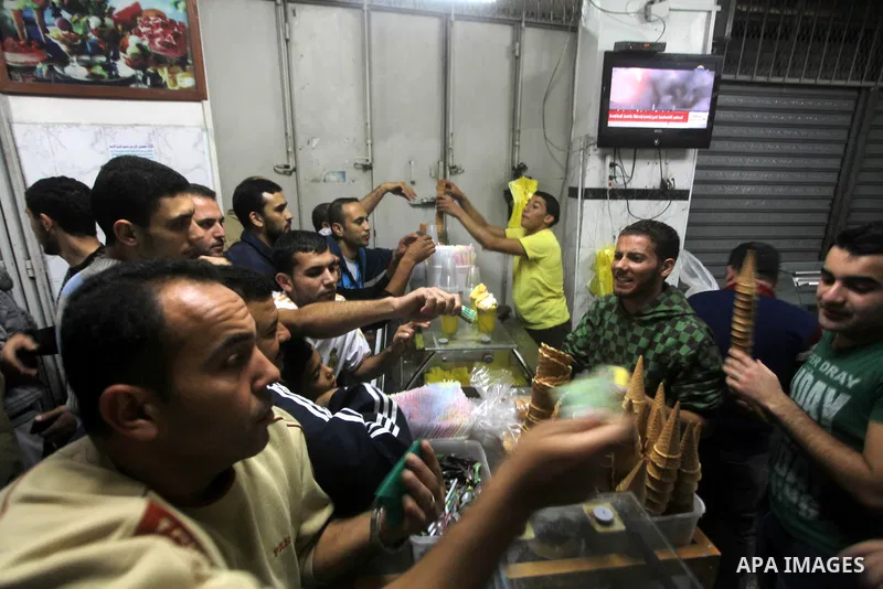 Palestinians celebrate what they say is a victory over Israel after an eight-day conflict in Gaza City, November 21, 2012. Israel and the Islamist Hamas movement agreed on Wednesday to an Egyptian-sponsored ceasefire to...