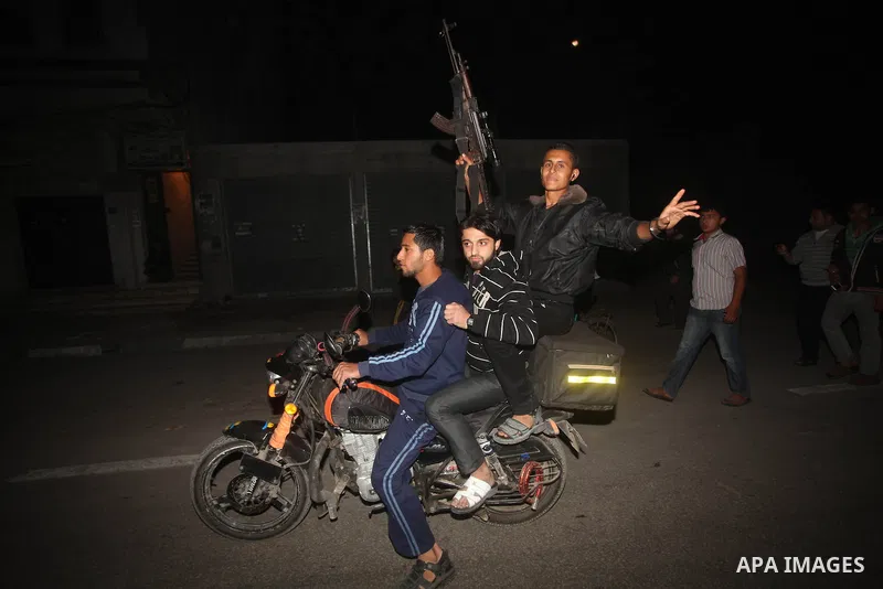 Palestinians celebrate what they say is a victory over Israel after an eight-day conflict in Gaza City, November 21, 2012. Israel and the Islamist Hamas movement agreed on Wednesday to an Egyptian-sponsored ceasefire to...