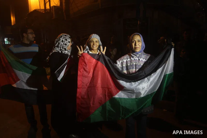 Palestinians celebrate what they say is a victory over Israel after an eight-day conflict in Gaza City, November 21, 2012. Israel and the Islamist Hamas movement agreed on Wednesday to an Egyptian-sponsored ceasefire to...