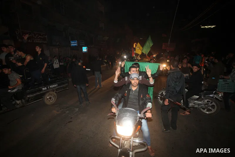 Palestinians celebrate what they say is a victory over Israel after an eight-day conflict in Gaza City, November 21, 2012. Israel and the Islamist Hamas movement agreed on Wednesday to an Egyptian-sponsored ceasefire to...