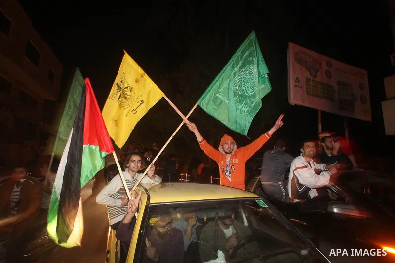 Palestinians celebrate what they say is a victory over Israel after an eight-day conflict in Gaza City, November 21, 2012. Israel and the Islamist Hamas movement agreed on Wednesday to an Egyptian-sponsored ceasefire to...