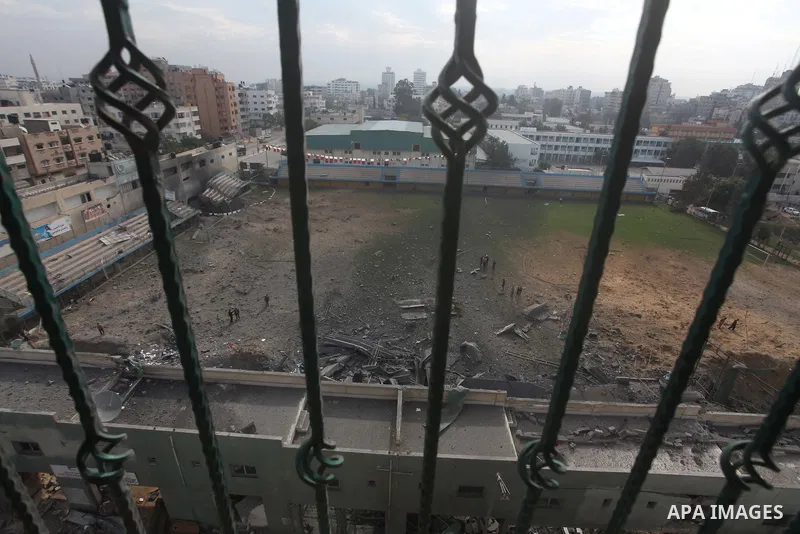 Palestinians inspect the debris of the destroyed Palestine Sports Stadium in Gaza City on November 22, 2012, after a ceasefire took hold in and around Gaza after a week of cross-border violence between Israel and Palesti...