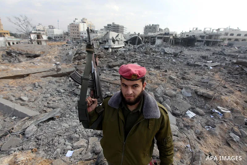 Hamas police officers embrace after their return to their destroyed Al-Saraya headquarters in Gaza City November 22, 2012, a day after a cease fire was declared between Israel and Hamas. An Egypt-brokered truce took hold...