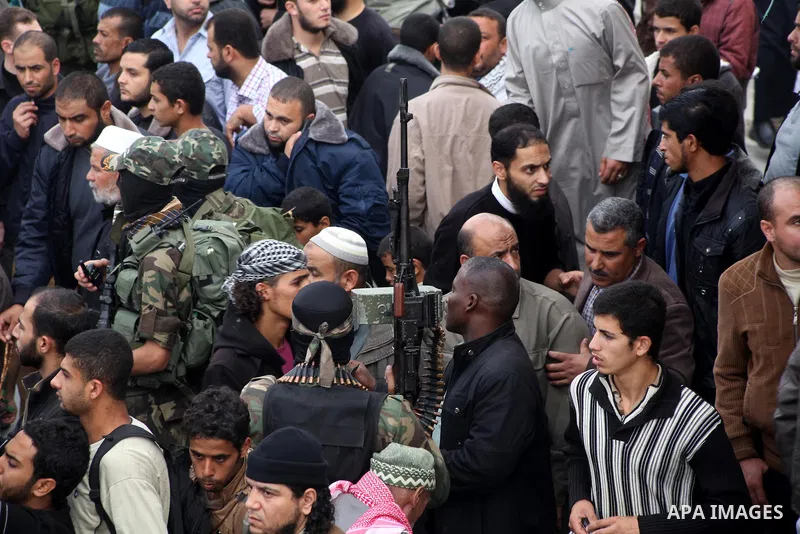 Hamas militants carry the body of a fellow comrade, whom medics said was killed in an Israeli air strike on Wednesday, during his funeral in the central Gaza Strip November 22, 2012. A ceasefire between Israel and Gaza's...