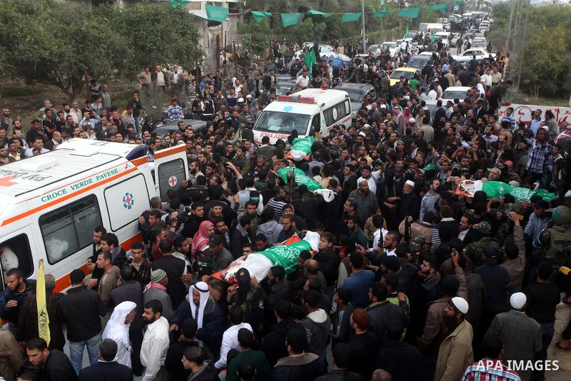 Hamas militants carry the body of a fellow comrade, whom medics said was killed in an Israeli air strike on Wednesday, during his funeral in the central Gaza Strip November 22, 2012. A ceasefire between Israel and Gaza's...