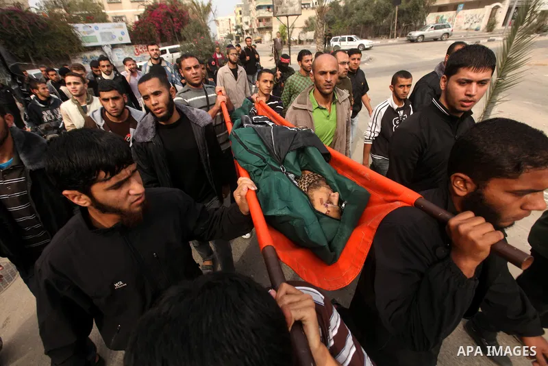 Palestinian militants from the Popular Front for the Liberation of Palestine (PFLP) attends the funeral of Mohammed Abdel-Rahman Ayesh, a militant from from the Al Nasser Brigades, an armed wing of the Popular Resistance...