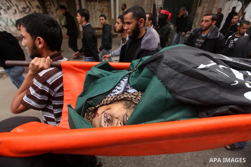 Palestinian militants from the Popular Front for the Liberation of Palestine (PFLP) attends the funeral of Mohammed Abdel-Rahman Ayesh, a militant from from the Al Nasser Brigades, an armed wing of the Popular Resistance...