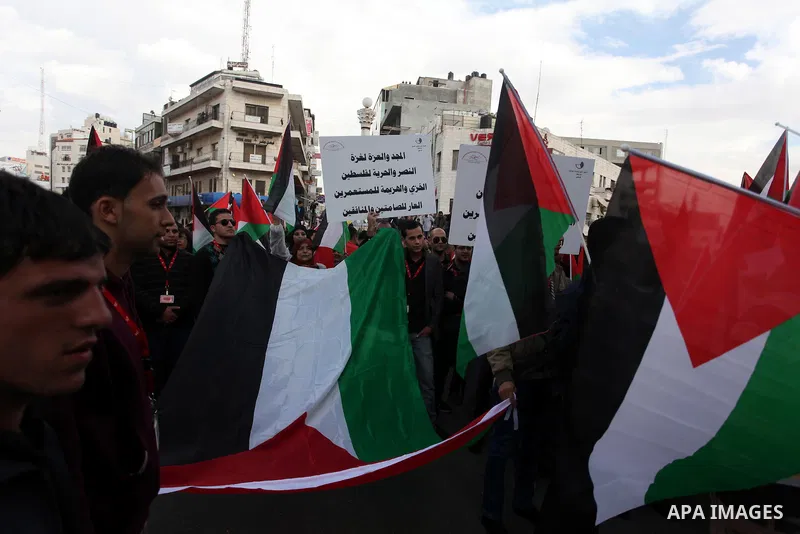 Palestinians celebrate what they call a victory over Israel, in the West Bank city of Ramallah, Nov. 22, 2012. Eight days of punishing Israeli airstrikes on Gaza and a barrage of Hamas rocket fire on Israeli ended inconc...