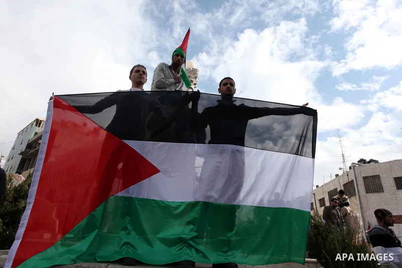 Palestinians celebrate what they call a victory over Israel, in the West Bank city of Ramallah, Nov. 22, 2012. Eight days of punishing Israeli airstrikes on Gaza and a barrage of Hamas rocket fire on Israeli ended inconc...