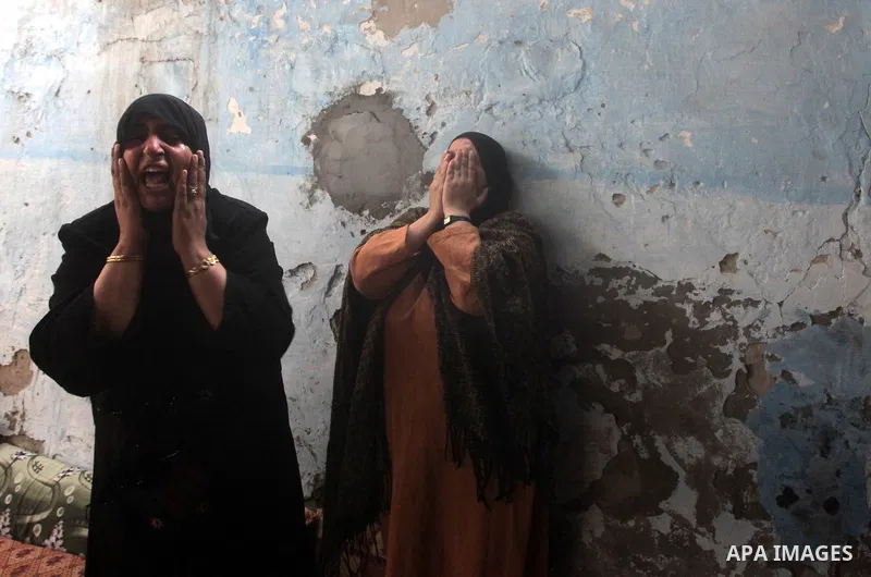 Relatives of three-year-old Reham Al Nabaheen mourn during her funeral in Al Nusairat refugee camp in the central Gaza Strip, 22 November 2012. Reham Al Nabaheen was reportedly killed after an Israeli air strike on Al Bu...
