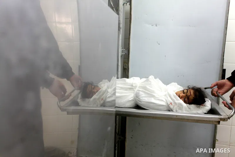 A man holds the body of his daughter, three-year-old Reham Al Nabaheen, during her funeral at Al Nusairat refugee camp in central Gaza Strip, 22 November 2012. Reham Al Nabaheen was reportedly killed after an Israeli air...
