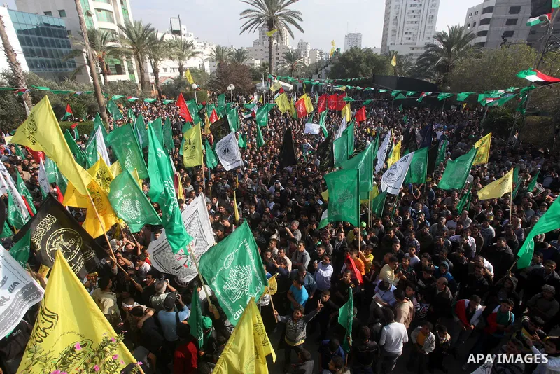 Palestinians gather to celebrate and listen to Palestinian prime minister in the Gaza Strip Ismail Haniya delivering a speech in Gaza City on November 22, 2012. The ruling Hamas movement declared the day to be a public h...