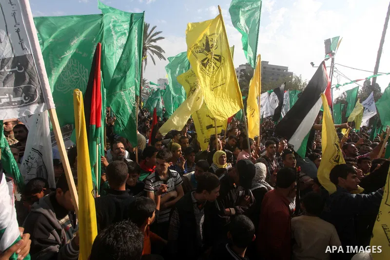 Palestinians gather to celebrate and listen to Palestinian prime minister in the Gaza Strip Ismail Haniya delivering a speech in Gaza City on November 22, 2012. The ruling Hamas movement declared the day to be a public h...