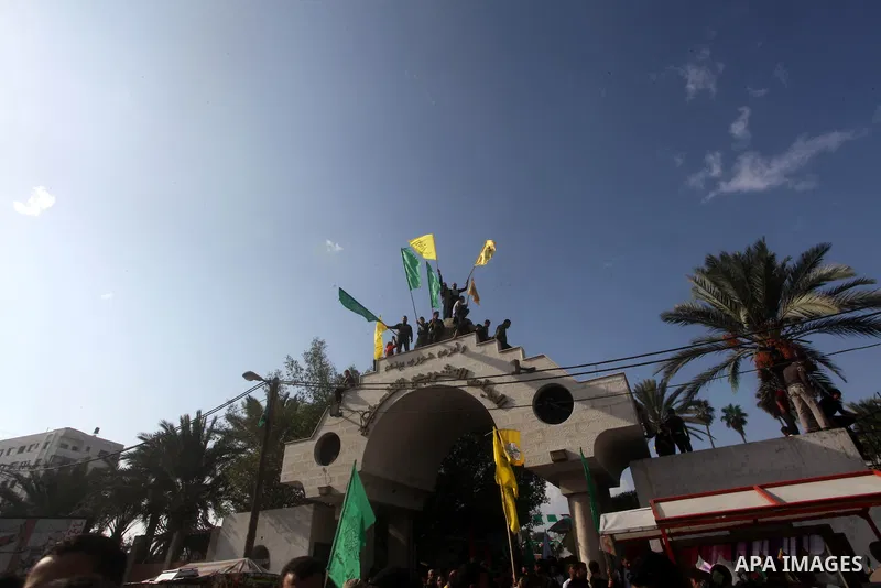Palestinians gather to celebrate and listen to Palestinian prime minister in the Gaza Strip Ismail Haniya delivering a speech in Gaza City on November 22, 2012. The ruling Hamas movement declared the day to be a public h...