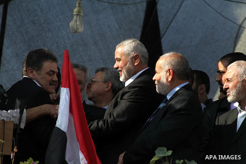 Palestinian prime minister in Gaza Ismail Haniyeh and Islamic Jihad leader Mohammed Al-Hindi, senior Fatah official Nabil Shaath and deputy speaker of Palestinian Parliament Ahmed Bahar celebrate what Palestinians say is...