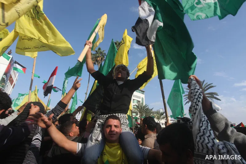 Palestinians gather to celebrate and listen to Palestinian prime minister in the Gaza Strip Ismail Haniya delivering a speech in Gaza City on November 22, 2012. The ruling Hamas movement declared the day to be a public h...