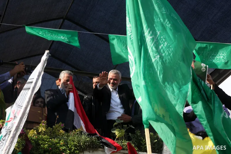 Palestinian prime minister in Gaza Ismail Haniyeh and Islamic Jihad leader Mohammed Al-Hindi, senior Fatah official Nabil Shaath and deputy speaker of Palestinian Parliament Ahmed Bahar celebrate what Palestinians say is...