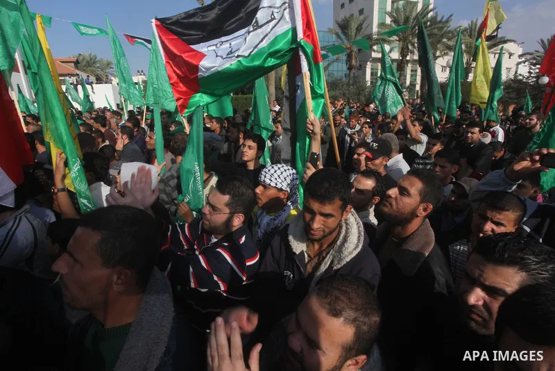 Palestinians gather to celebrate and listen to Palestinian prime minister in the Gaza Strip Ismail Haniya delivering a speech in Gaza City on November 22, 2012. The ruling Hamas movement declared the day to be a public h...
