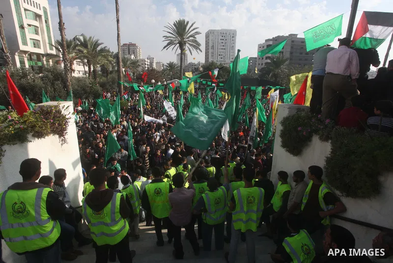 Palestinians gather to celebrate and listen to Palestinian prime minister in the Gaza Strip Ismail Haniya delivering a speech in Gaza City on November 22, 2012. The ruling Hamas movement declared the day to be a public h...