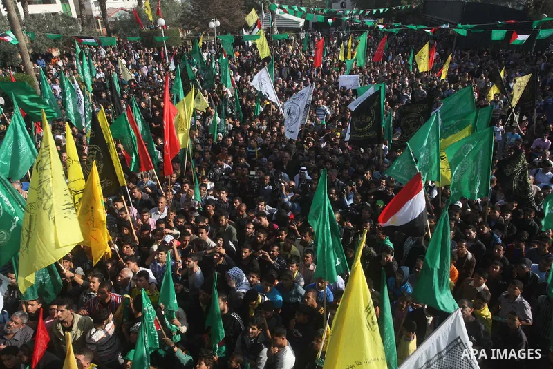 Palestinians gather to celebrate and listen to Palestinian prime minister in the Gaza Strip Ismail Haniya delivering a speech in Gaza City on November 22, 2012. The ruling Hamas movement declared the day to be a public h...