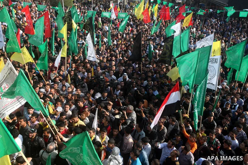 Palestinians gather to celebrate and listen to Palestinian prime minister in the Gaza Strip Ismail Haniya delivering a speech in Gaza City on November 22, 2012. The ruling Hamas movement declared the day to be a public h...