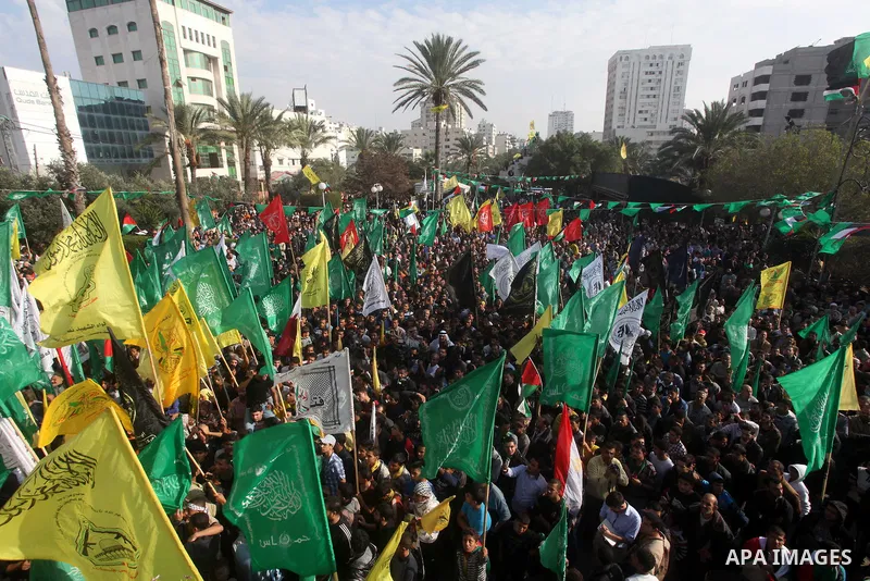 Palestinians gather to celebrate and listen to Palestinian prime minister in the Gaza Strip Ismail Haniya delivering a speech in Gaza City on November 22, 2012. The ruling Hamas movement declared the day to be a public h...