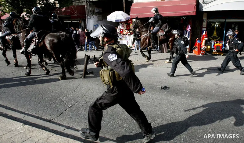 Israeli mounted police disperse Palestinian protestors who threw stones at a police station in Salahaddin street, a main commercial area of mostly Arab east Jerusalem, on November 22, 2012 . The incident followed the det...