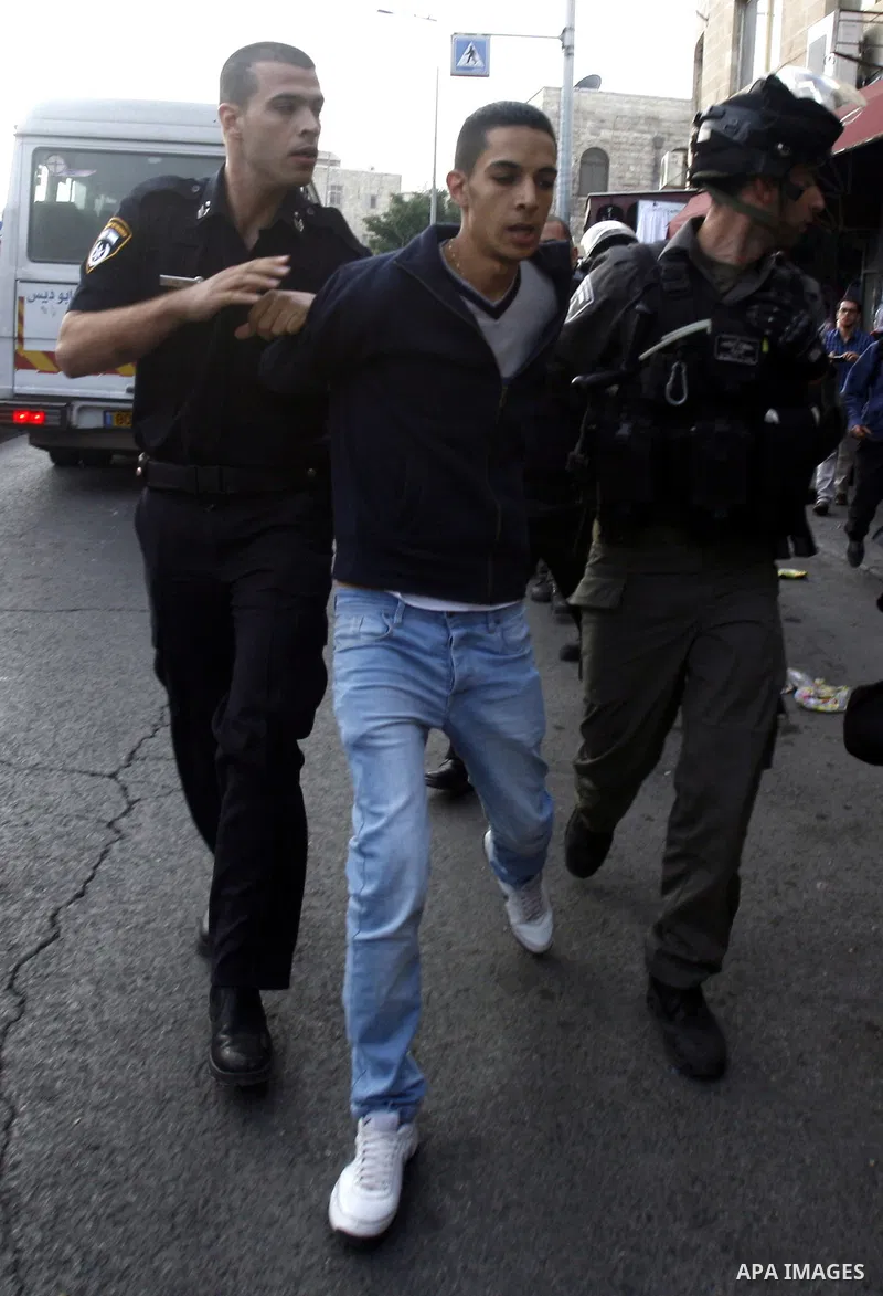 Israeli forces arrest a Palestinian youth on November 22, 2012 after Palestinians threw stones at a police station in Salahaddin street, a main commercial area of mostly Arab east Jerusalem. The incident followed the det...
