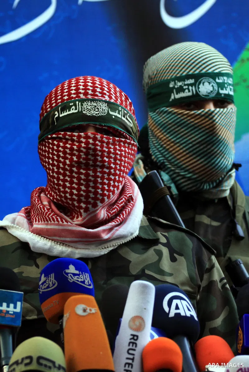 Abu Obaida , the spokesman for the Ezzedine Al-Qassam Brigades, the armed wing of Hamas, speaks during a news conference in Gaza City on November 22, 2012 at the house of their late leader Ahmed Jaabari, who was killed w...