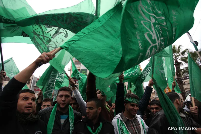 Palestinians wave Hamas flags during a rally celebrating what they claim to be Hamas' victory over Israel in the Gaza conflict, in the West Bank city of Ramallah November 23, 2012. Israeli troops at the Gaza border shot...