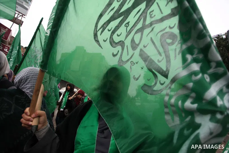 Palestinians wave Hamas flags during a rally celebrating what they claim to be Hamas' victory over Israel in the Gaza conflict, in the West Bank city of Ramallah November 23, 2012. Israeli troops at the Gaza border shot...