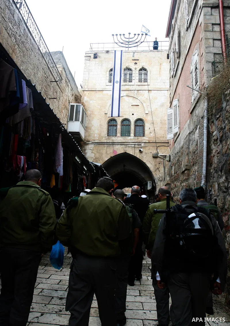 Israeli border police officers stand guard outside Damascus Gate in Jerusalem's Old City November 23, 2012. Israeli security forces declared an age limit on Friday for Palestinians wanting to enter the Old City, only all...