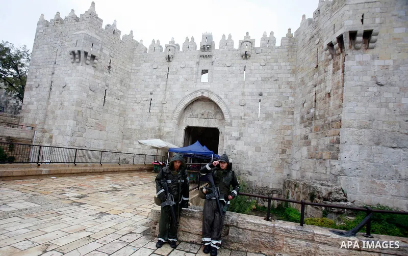 Israeli border police officers stand guard outside Damascus Gate in Jerusalem's Old City November 23, 2012. Israeli security forces declared an age limit on Friday for Palestinians wanting to enter the Old City, only all...