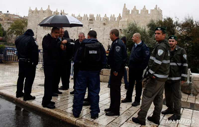 Israeli border police officers stand guard outside Damascus Gate in Jerusalem's Old City November 23, 2012. Israeli security forces declared an age limit on Friday for Palestinians wanting to enter the Old City, only all...