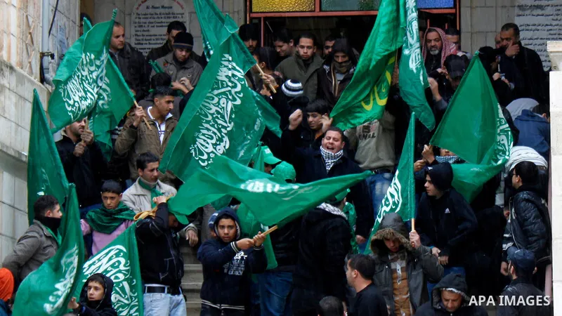 Palestinian supporters of the Islamist movement Hamas shout slogans during a demonstration in the West Bank city of Nablus 23 November 2012 to show solidarity with Palestinians in the Gaza Strip. Photo by Nedal Eshtayah