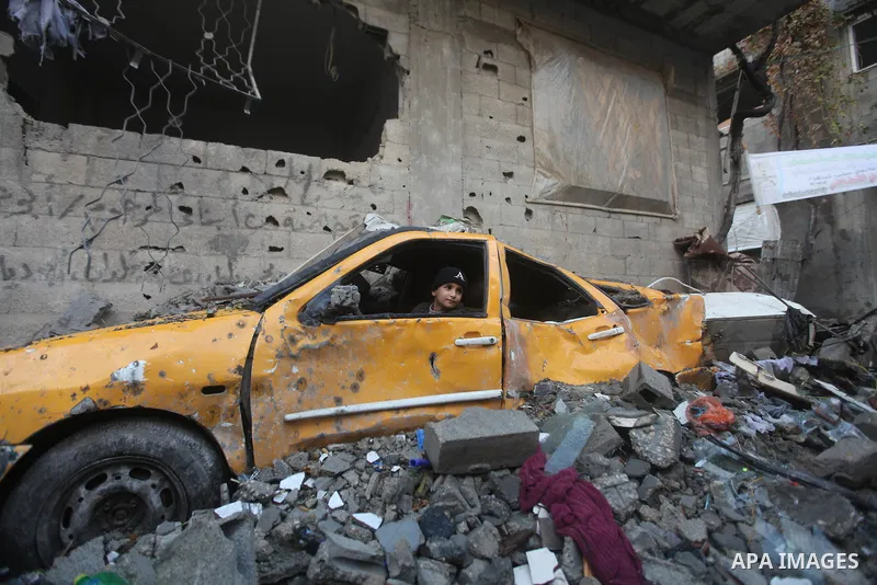 Palestinian Family members inspect thier house destroyed during a recent Israeli airstrike in Gaza City, 23 November 2012. Palestinians and Israelis on both sides of the Gaza border tried to resume everyday life after a...