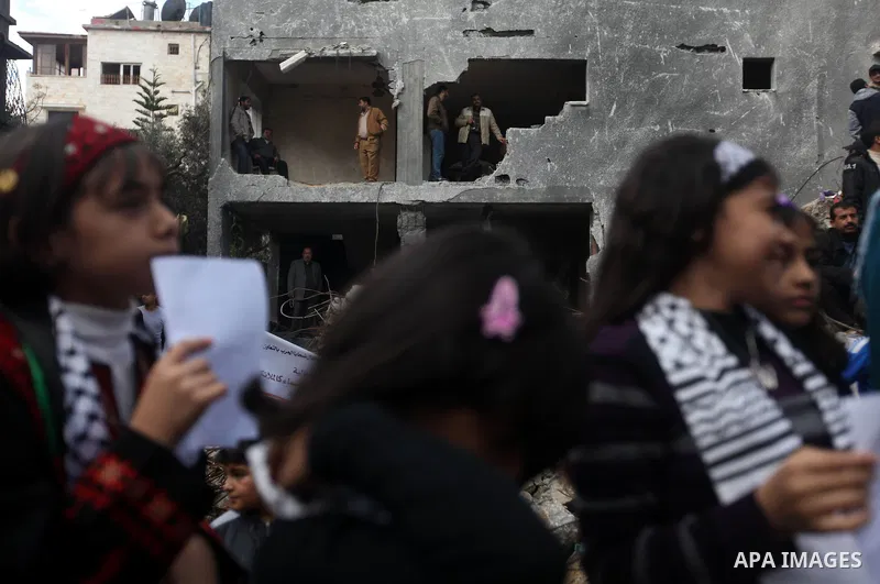 Palestinians release balloons at the site of the destroyed house of the Dalou family in Gaza City November 24, 2012. Eleven members of the Dalou family were killed after an Israeli air strike on their house during the ei...