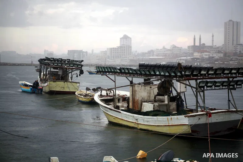 Palestinian fishermen prepare their boats in the port of Gaza on the Mediterranean coast in Gaza City on November 24, 2012, as a fragile truce between Israel and militant groups in Gaza enters its third day. Israel slamm...