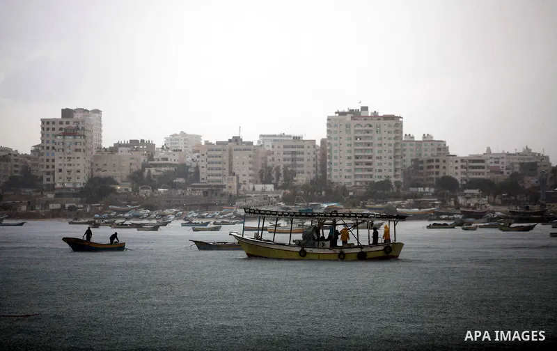 Palestinian fishermen prepare their boats in the port of Gaza on the Mediterranean coast in Gaza City on November 24, 2012, as a fragile truce between Israel and militant groups in Gaza enters its third day. Israel slamm...