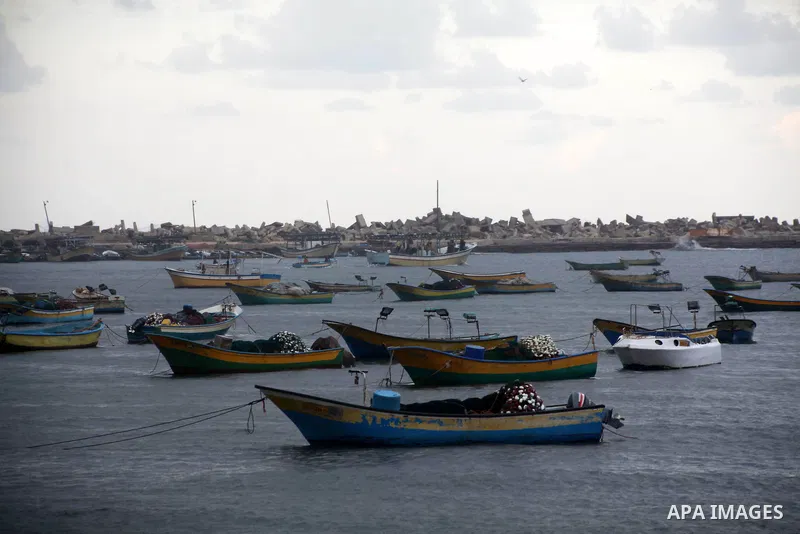 Palestinian fishermen prepare their boats in the port of Gaza on the Mediterranean coast in Gaza City on November 24, 2012, as a fragile truce between Israel and militant groups in Gaza enters its third day. Israel slamm...