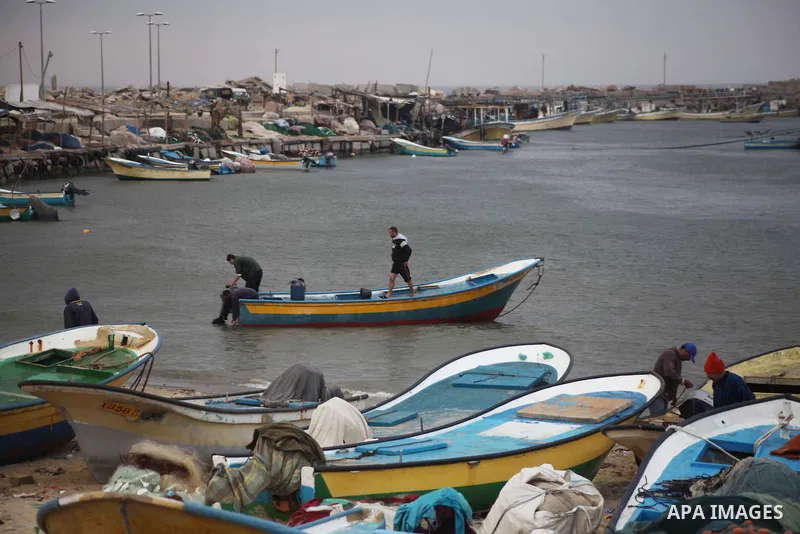 Palestinian fishermen prepare their boats in the port of Gaza on the Mediterranean coast in Gaza City on November 24, 2012, as a fragile truce between Israel and militant groups in Gaza enters its third day. Israel slamm...
