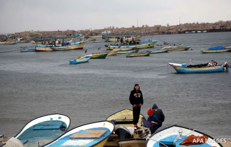 Palestinian fishermen prepare their boats in the port of Gaza on the Mediterranean coast in Gaza City on November 24, 2012, as a fragile truce between Israel and militant groups in Gaza enters its third day. Israel slamm...