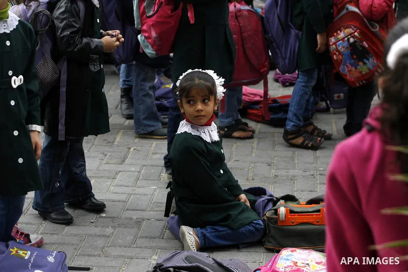 Palestinian students play in a school in Rafah southern Gaza City, 25 November 2012. Normal life in Gaza resumed remarkably fast after a ceasefire agreement was announced following eight days of cross border violence bet...