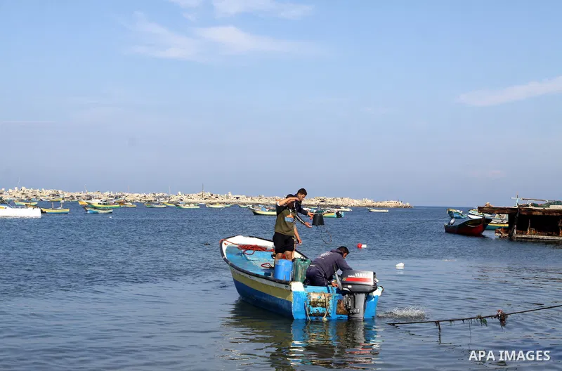Palestinian fishermen prepare their boats in the port of Gaza on the Mediterranean coast, on Nov. 26, 2012, as a fragile truce between Israel and militant groups in Gaza enters its third day. Israel slammed Palestinian p...