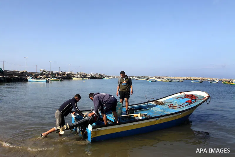 Palestinian fishermen prepare their boats in the port of Gaza on the Mediterranean coast, on Nov. 26, 2012, as a fragile truce between Israel and militant groups in Gaza enters its third day. Israel slammed Palestinian p...
