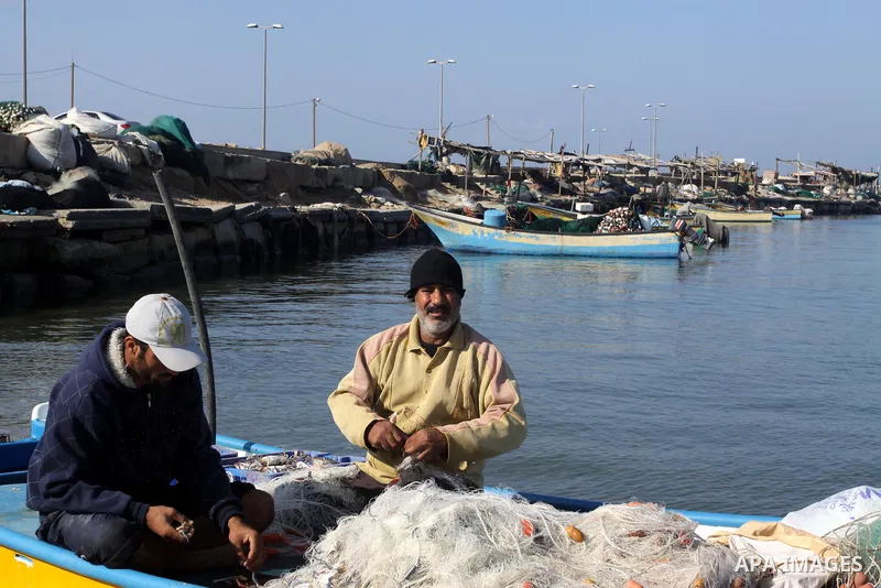 Palestinian fishermen prepare their boats in the port of Gaza on the Mediterranean coast, on Nov. 26, 2012, as a fragile truce between Israel and militant groups in Gaza enters its third day. Israel slammed Palestinian p...